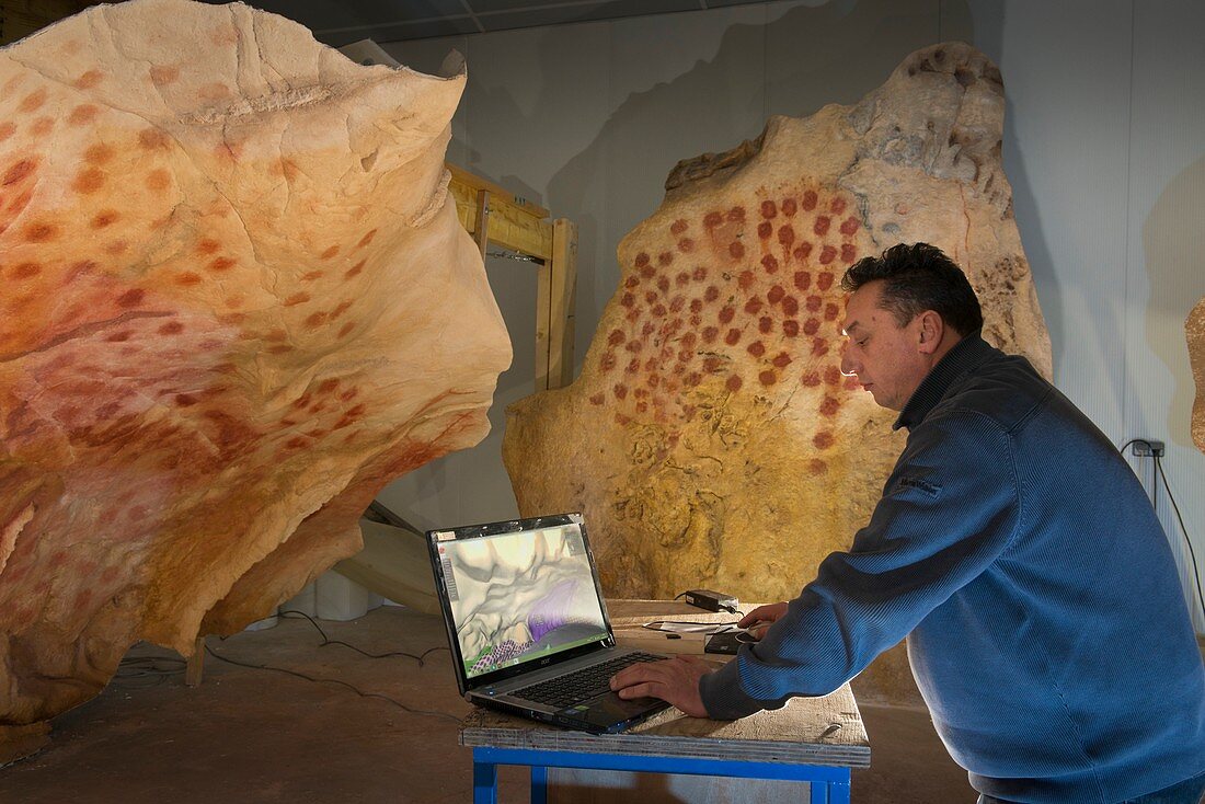 Checking replica panels of the Chauvet Cave, France