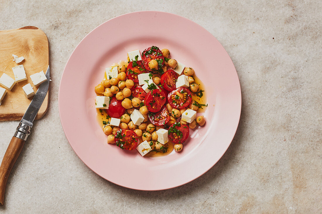 Chickpea and tomato salad with feta cheese and parsley