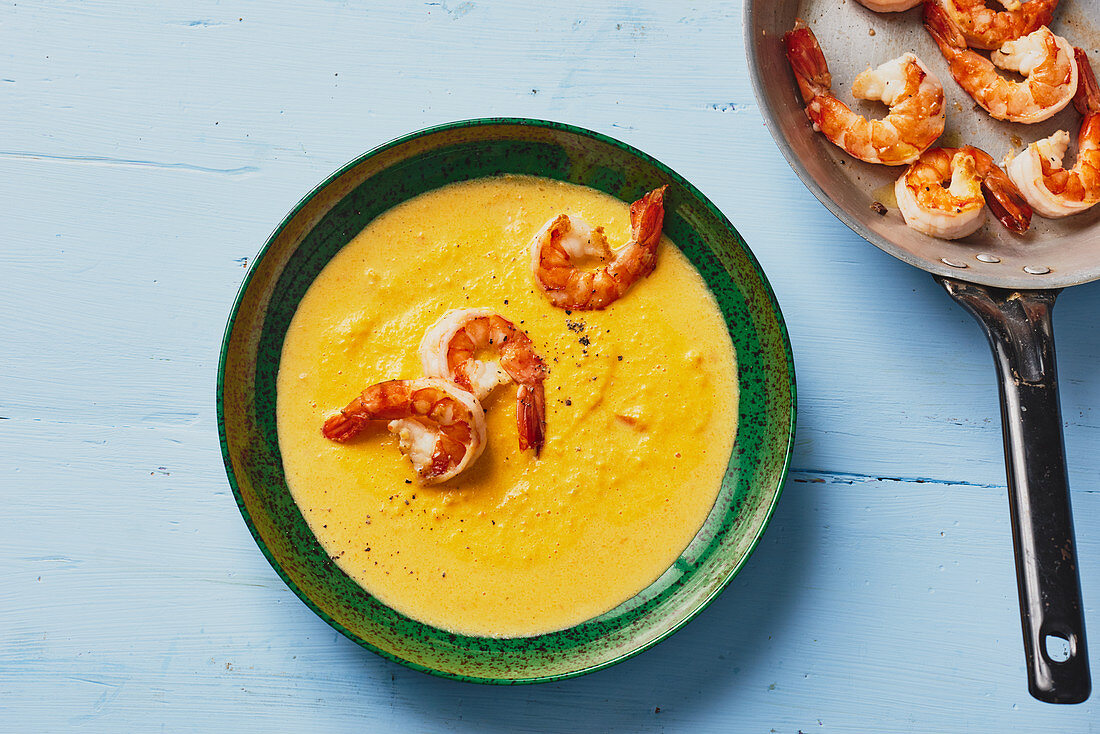 Creamy carrot soup with prawns