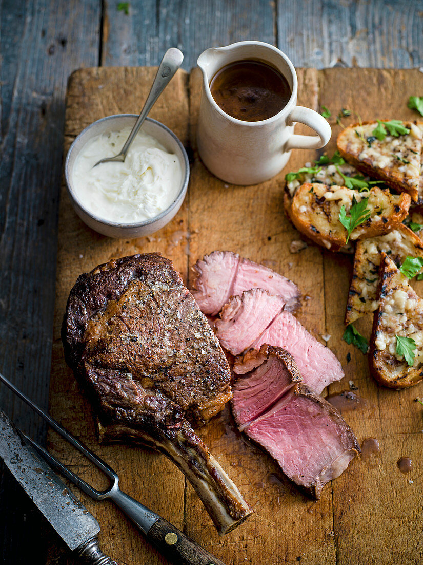 Roast beef with bone marrow crostini and horseradish sauce