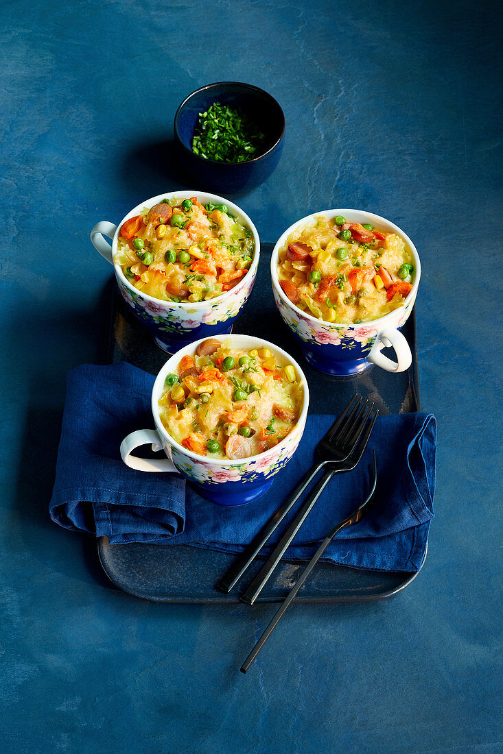 'Confetti' casserole for kids with peas, carrots and sausages