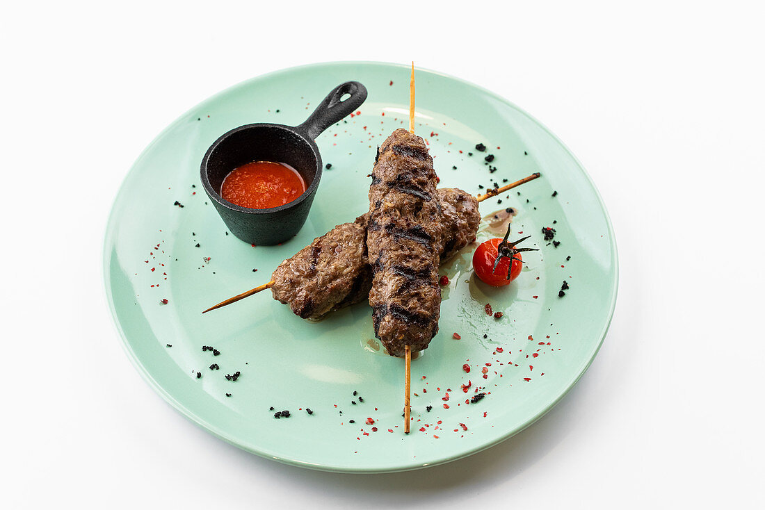 Turkish kebab with tomato sauce