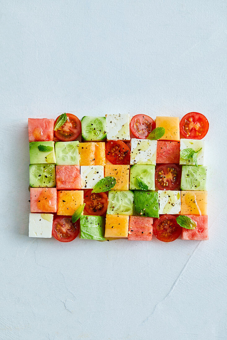 Summer snacks with melon, feta, cucumber and tomato