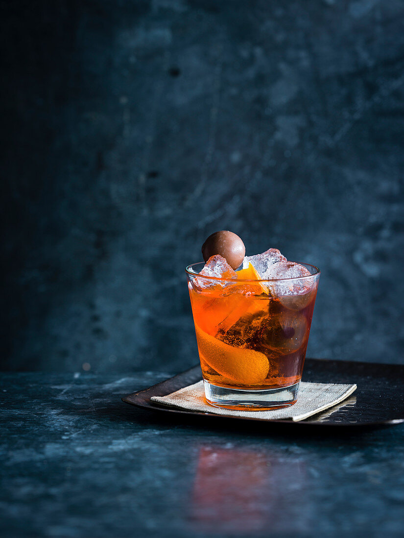 Ron de replay cocktail with Aperol, Grand Marnier and Mozart chocolate ball