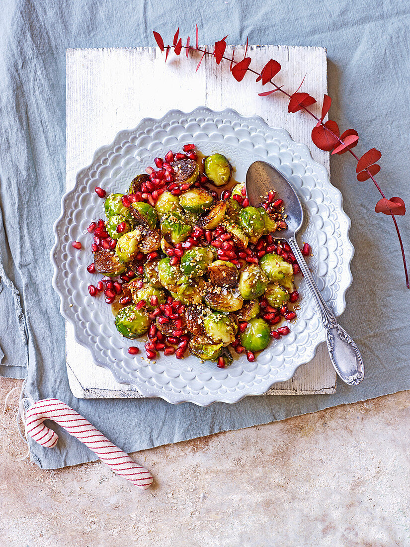 Blackened sprouts with pomegranates, dates and sesame