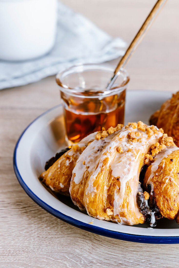 Poppy seed croissant with caramel sauce