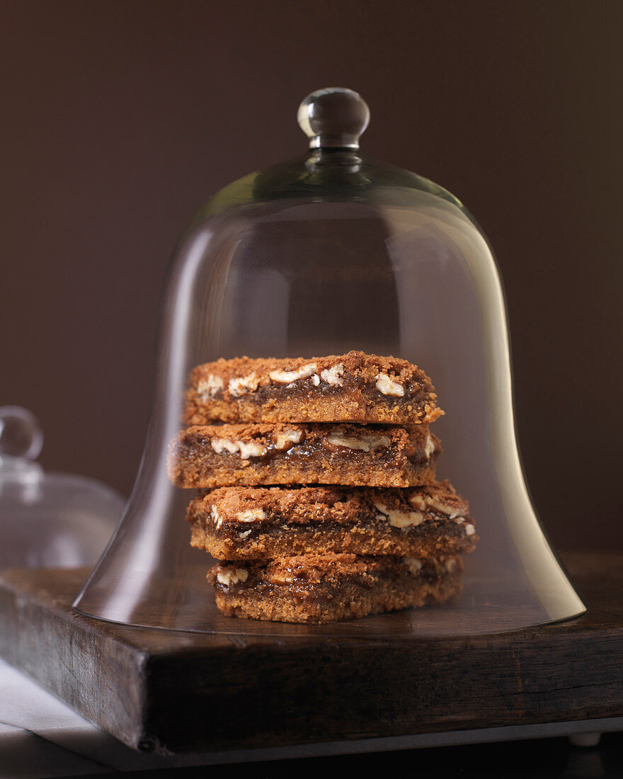 Dessert Squares on Wood Surface in Bell Jar,