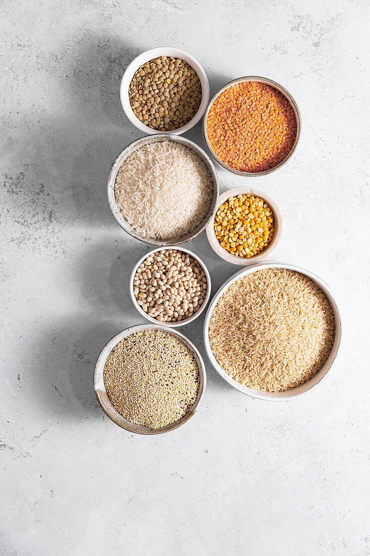 Bowls of rice, quinoa, beans, lentils and peas