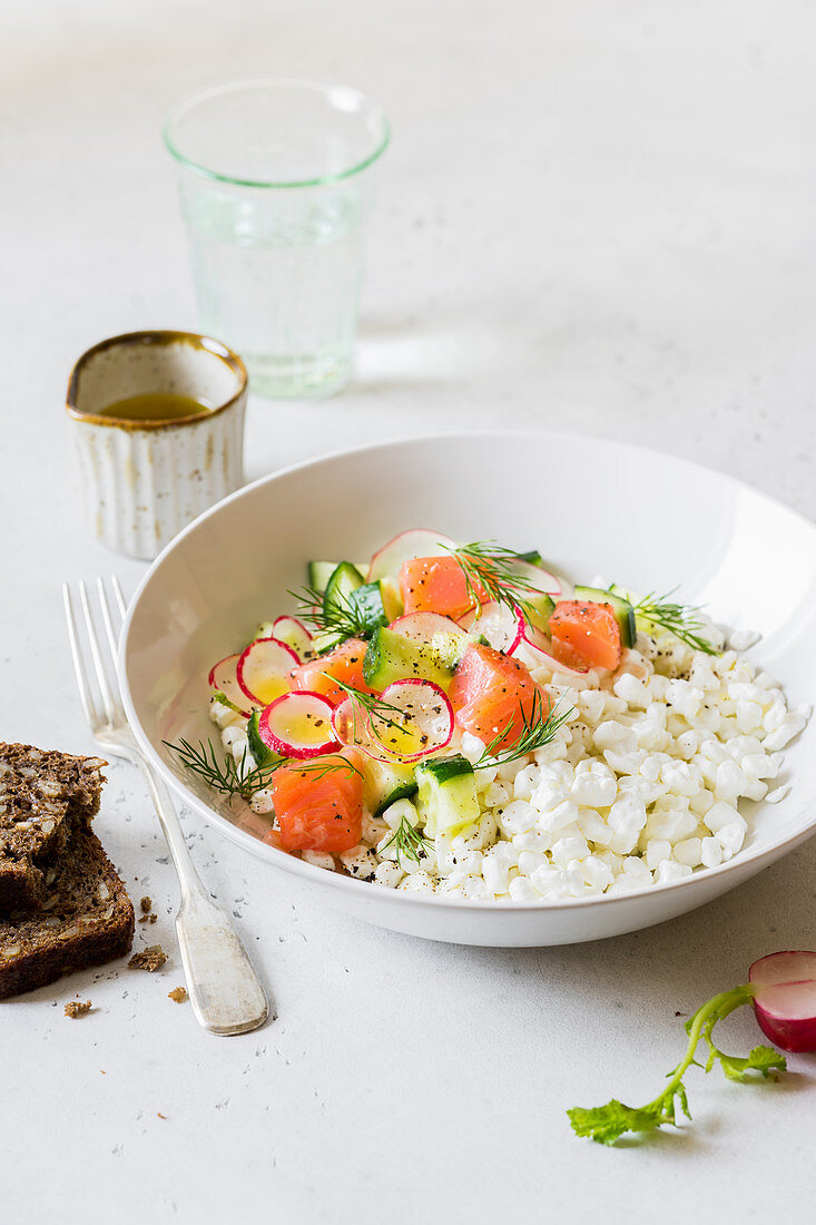 Cottage cheese with salmon, radish, cucumber, dill and olive oil