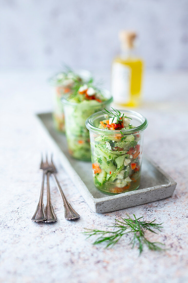 Cucumber salad with red pepper, feta and horseradish oil