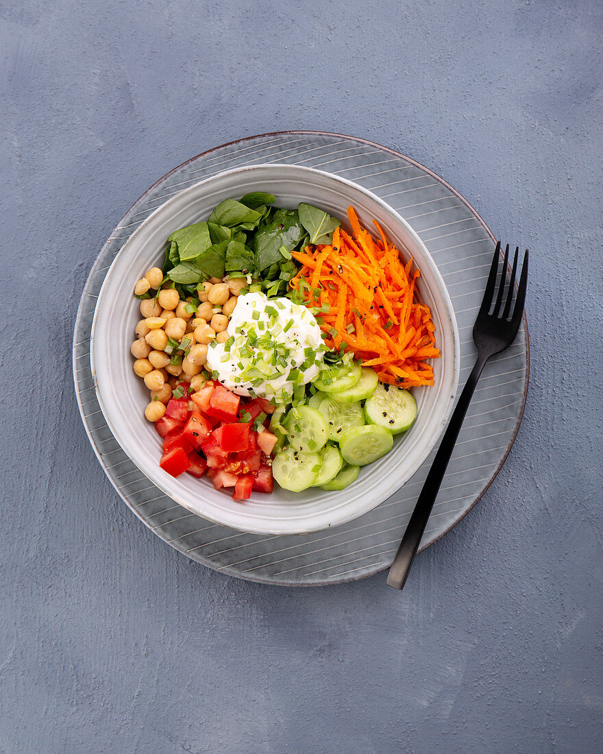 Chickpea bowl with sour cream and spinach