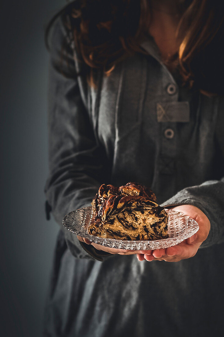 Girl offering some chocolate babka