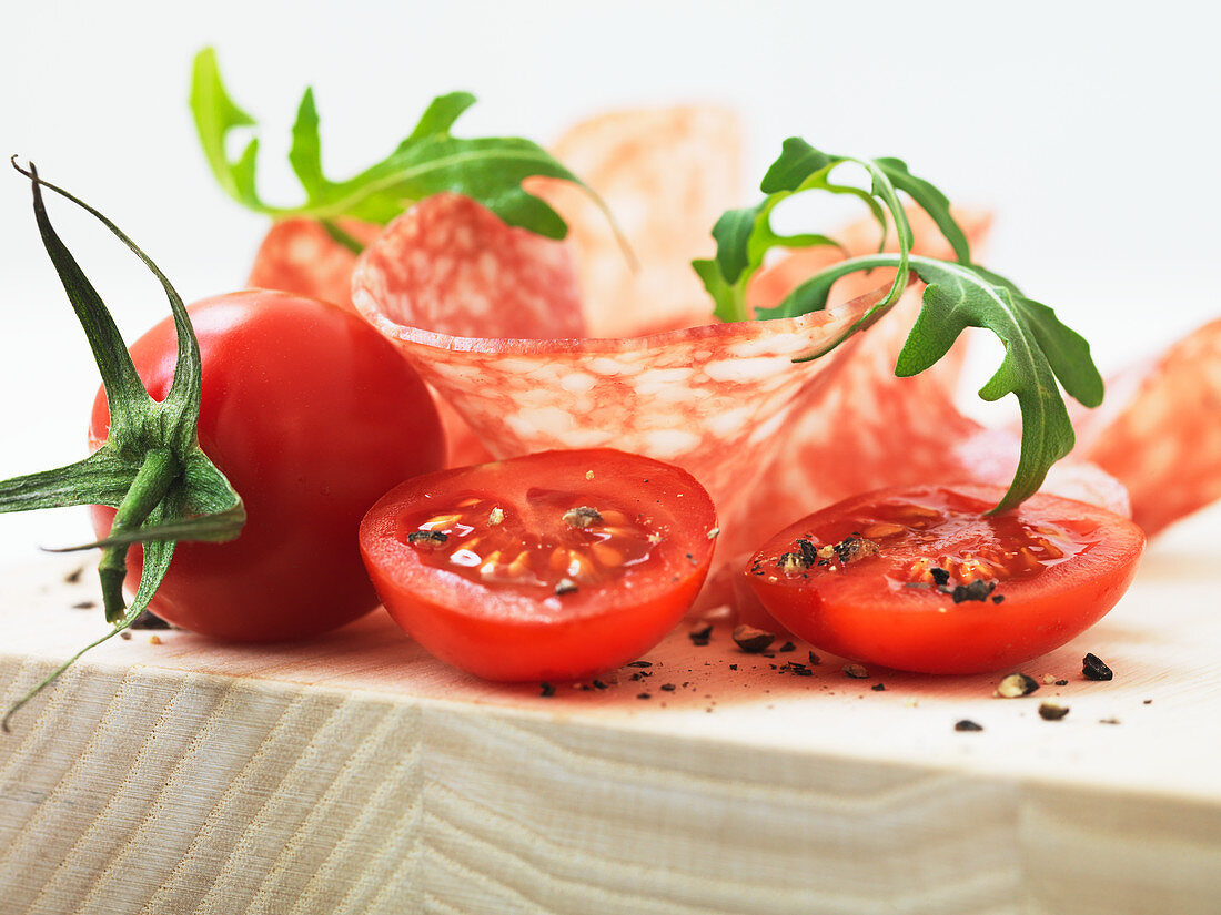 Antipasti: salami, arugula and tomatoes