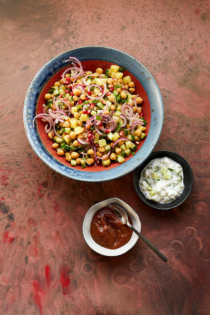 Indian chickpea salad with potatoes, cucumber and pomegranate seeds