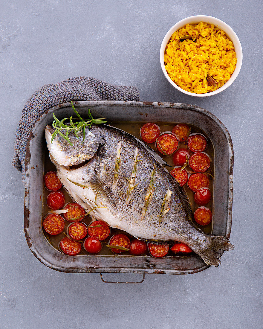 Oven-baked rosemary bream with turmeric rice