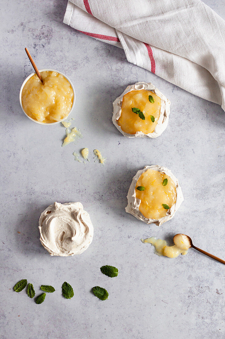 Mini merignues with lemon curd and fresh mint