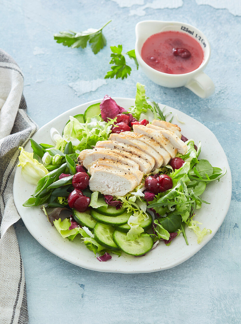 Salad with chicken breast and cherries