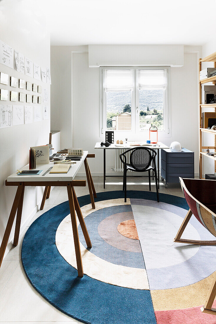 Study with two desks and round carpet