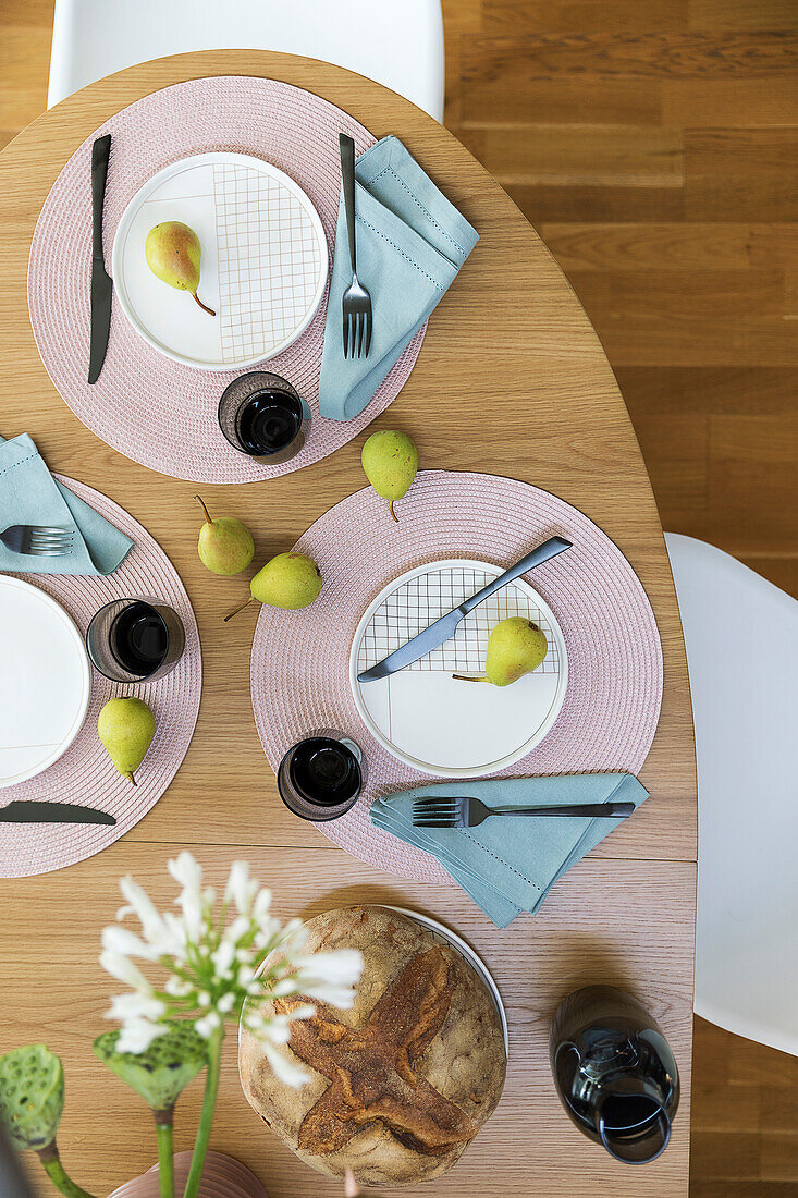 View of the laid table with round coasters