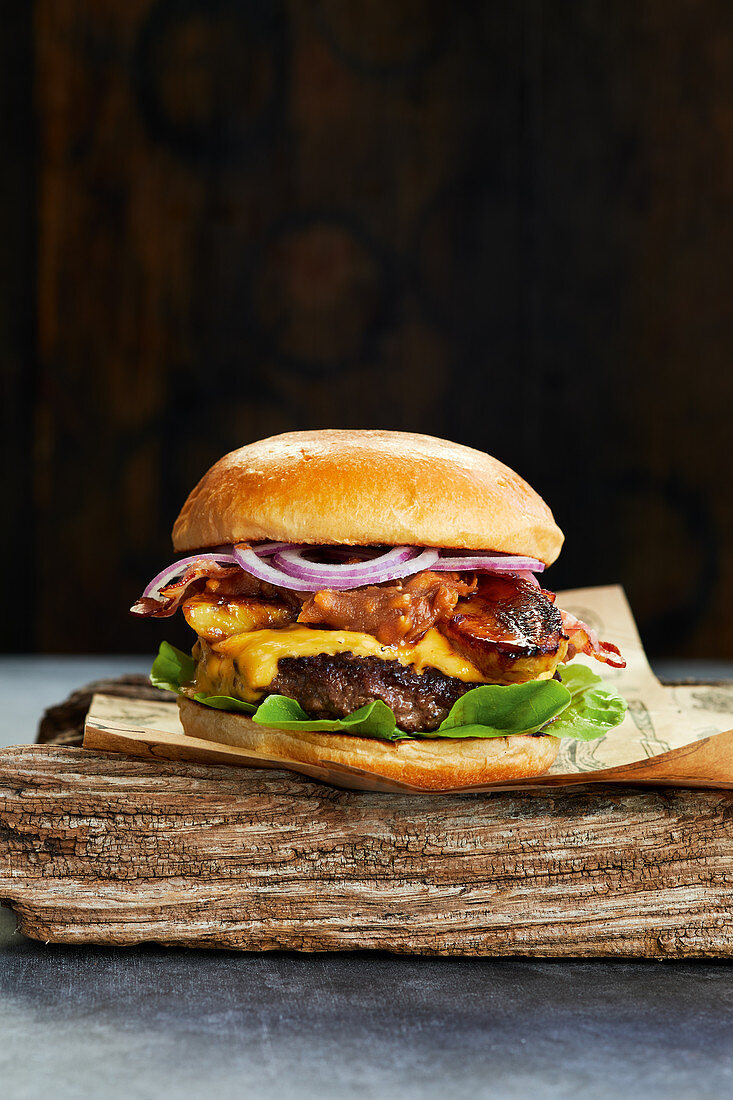 King of burgers with smoked bacon, cheese and grilled bananas