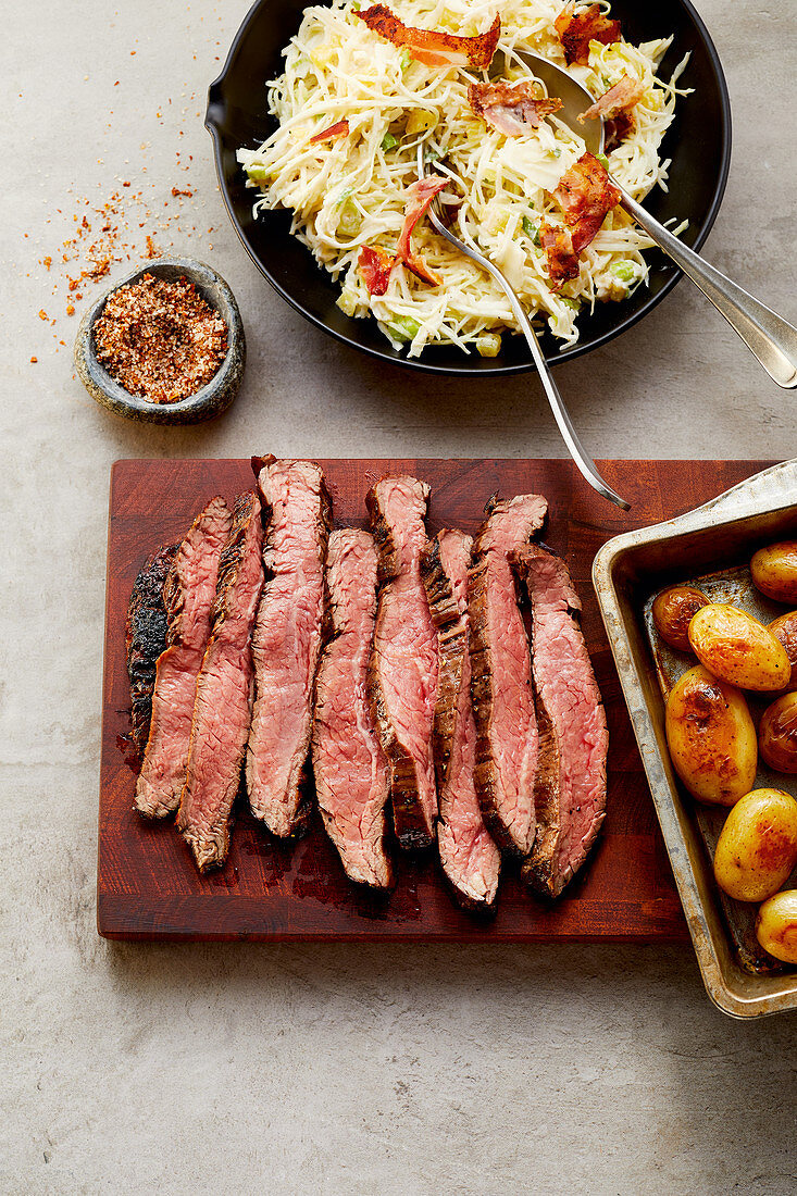 Caveman-style flank steak with bacon chipotle slaw