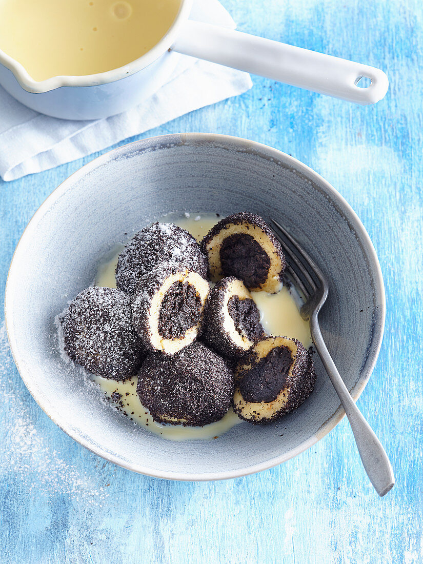 Small poppy seed dumplings with vanilla sauce