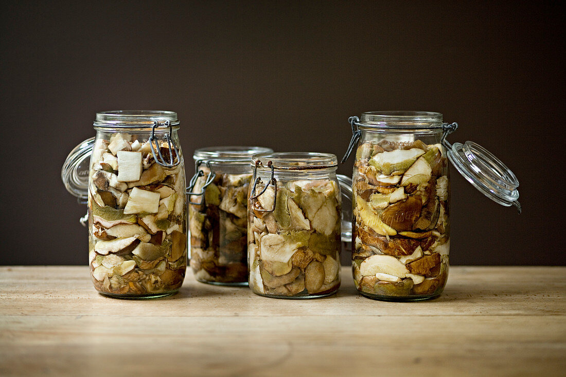 Glass jars of preserved porcini mushrooms