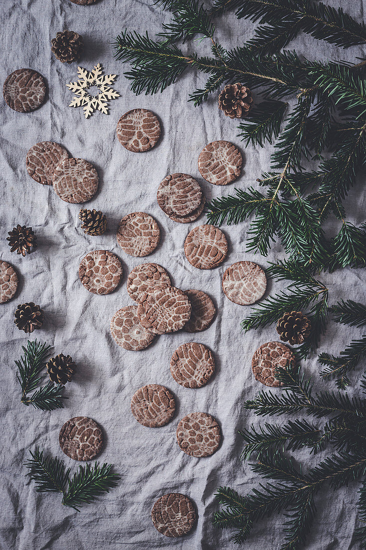 Gingerbread stamped cookies on a gray fabric