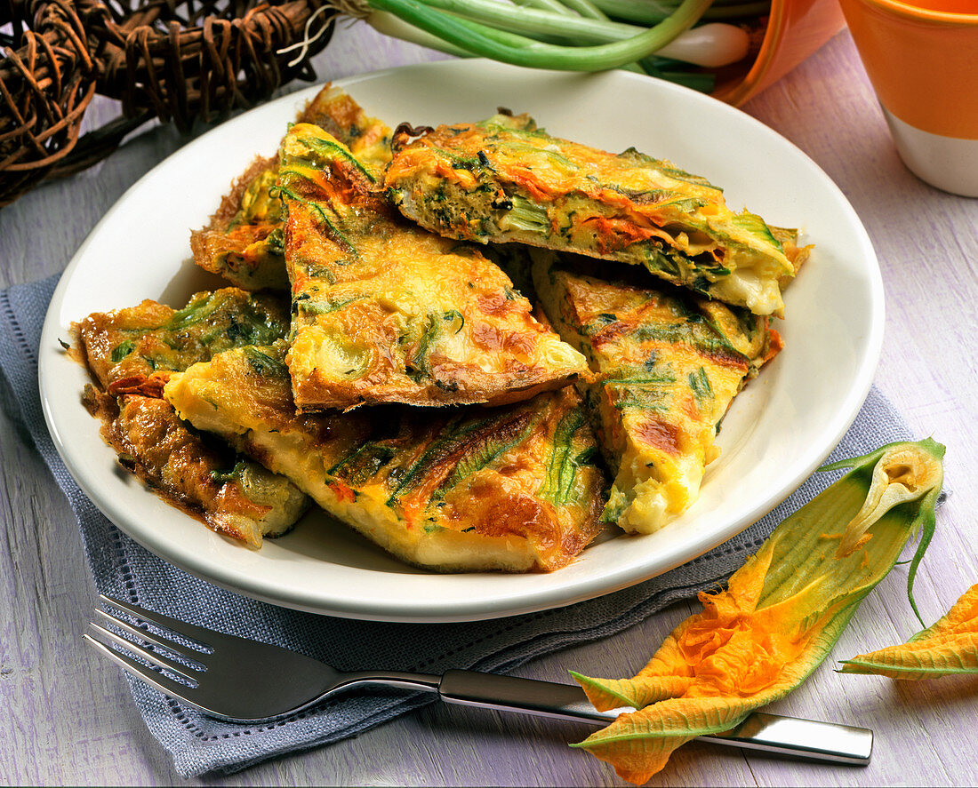 Frittata with caciotta cheese and courgette flowers
