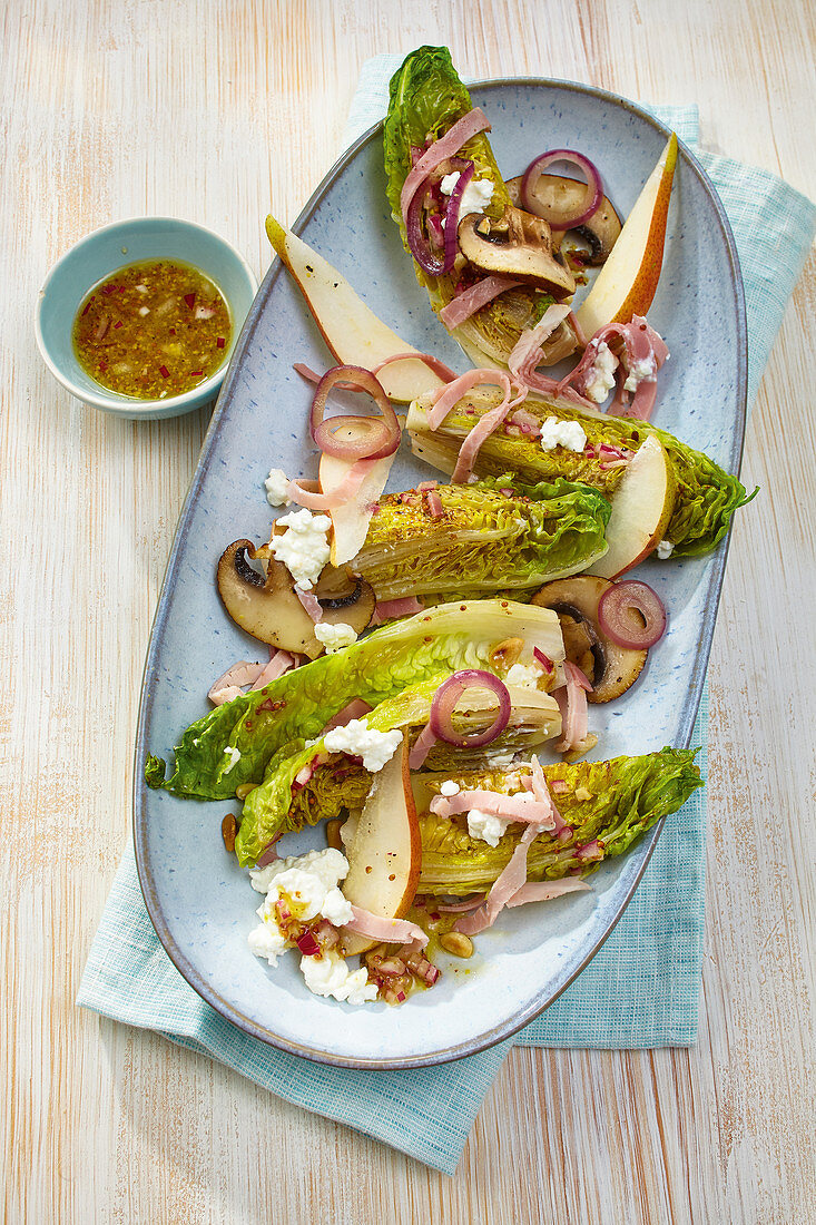 Fried romaine lettuce with ham, cream cheese and pears
