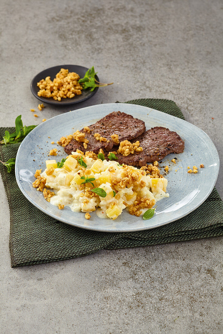 Turnip risotto with nut crumbs with beef minute steaks