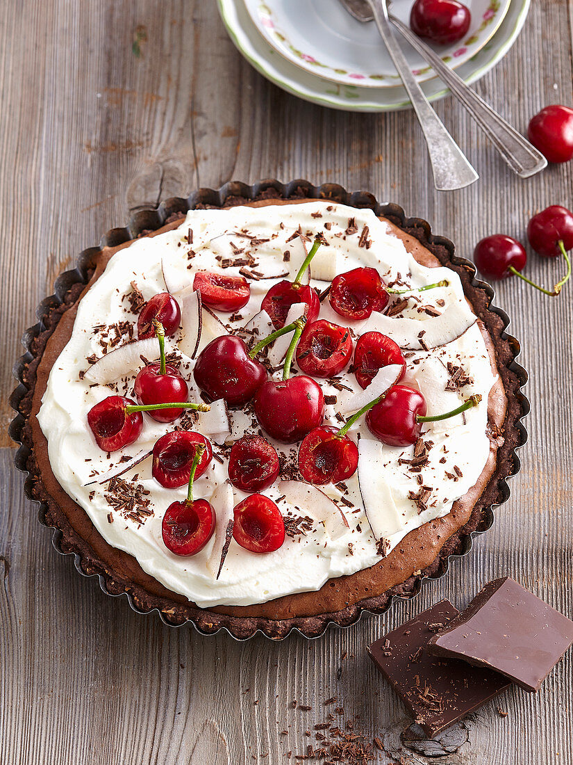 Chocolate pie with coconut and cherries