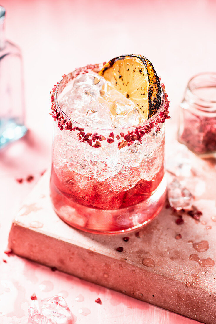 Raspberry Gin Fizz in glass tumbler