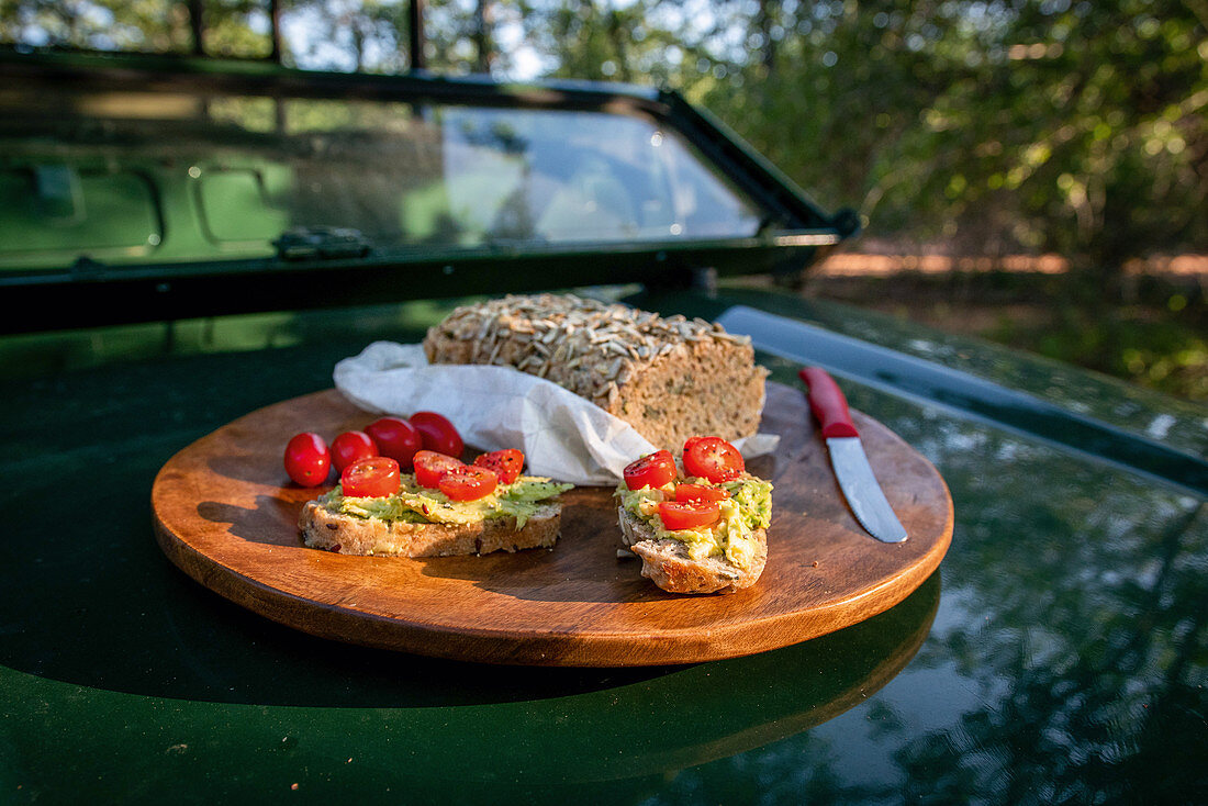 Homemade campfire bread with cherry tomatoes and avocado