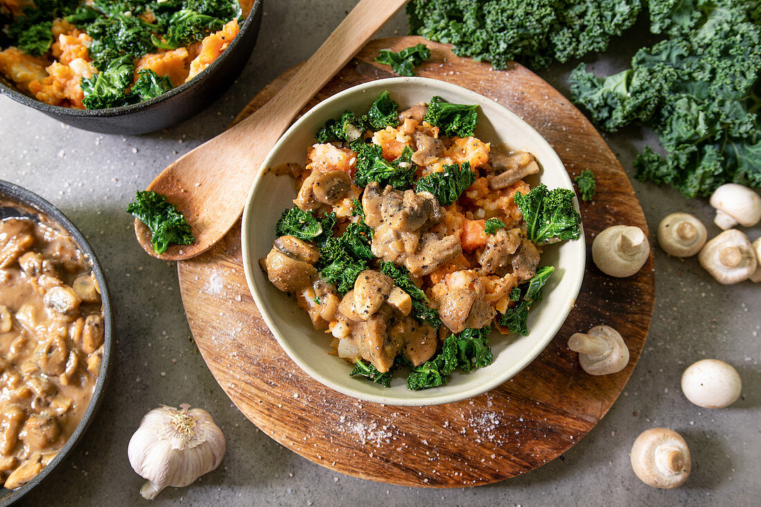 Mashed potatoes and carrots with mushroom sauce and kale