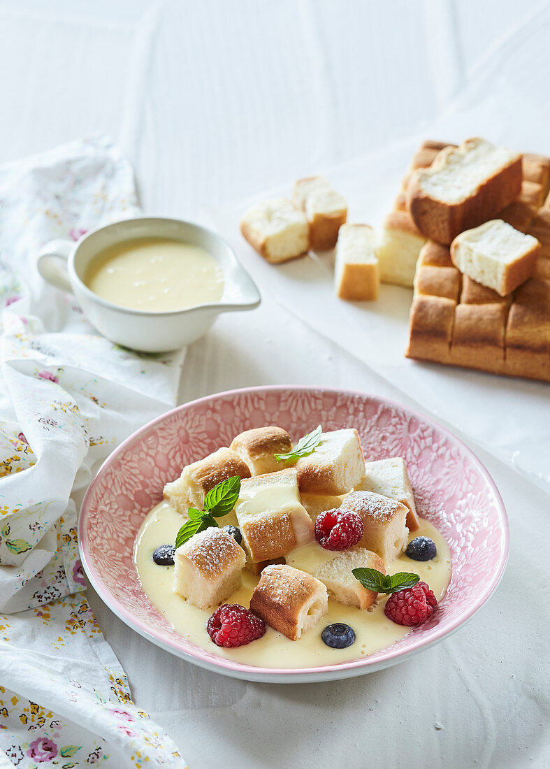 Sweet dumplings (mini buns) with vanilla sauce and forrest berries