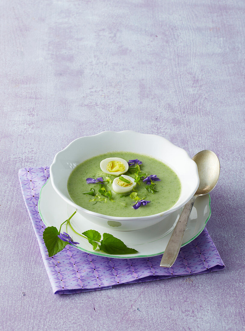 Spring herb soup with violets
