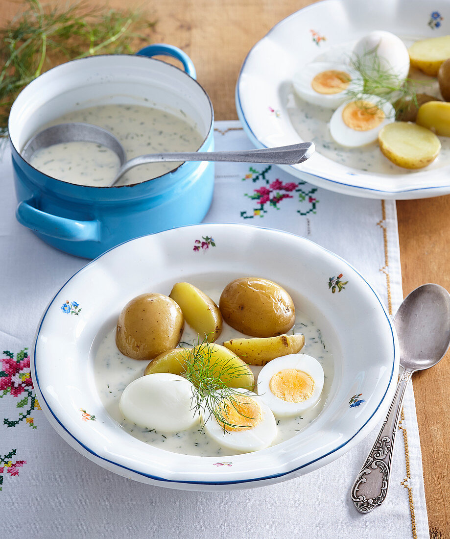 Dill sauce with jacked potatoes and boiled eggs