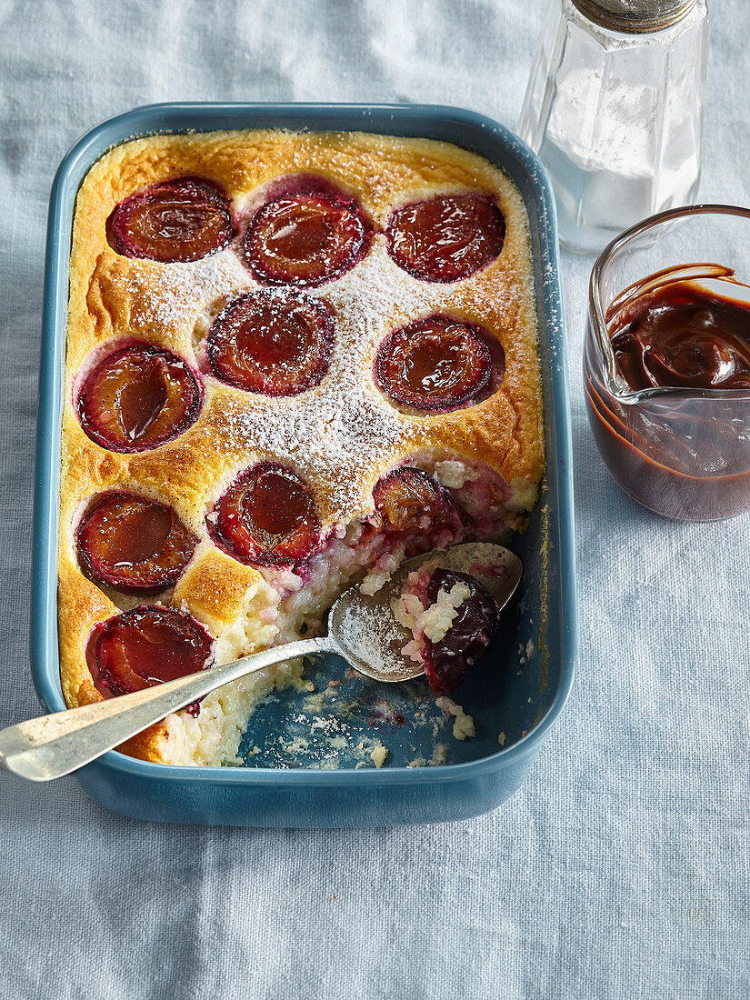 Rice pudding with plums and chocolate glaze
