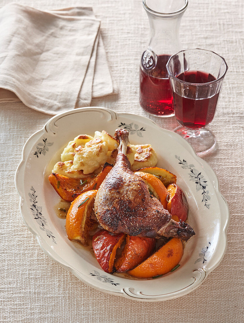 Baked goose legs with pumpkin, oranges and potato gnocchi