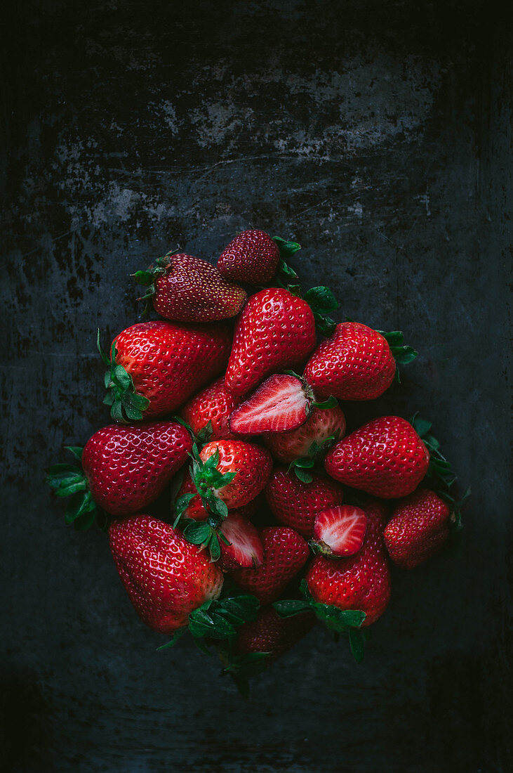 Strawberries on the dark surface