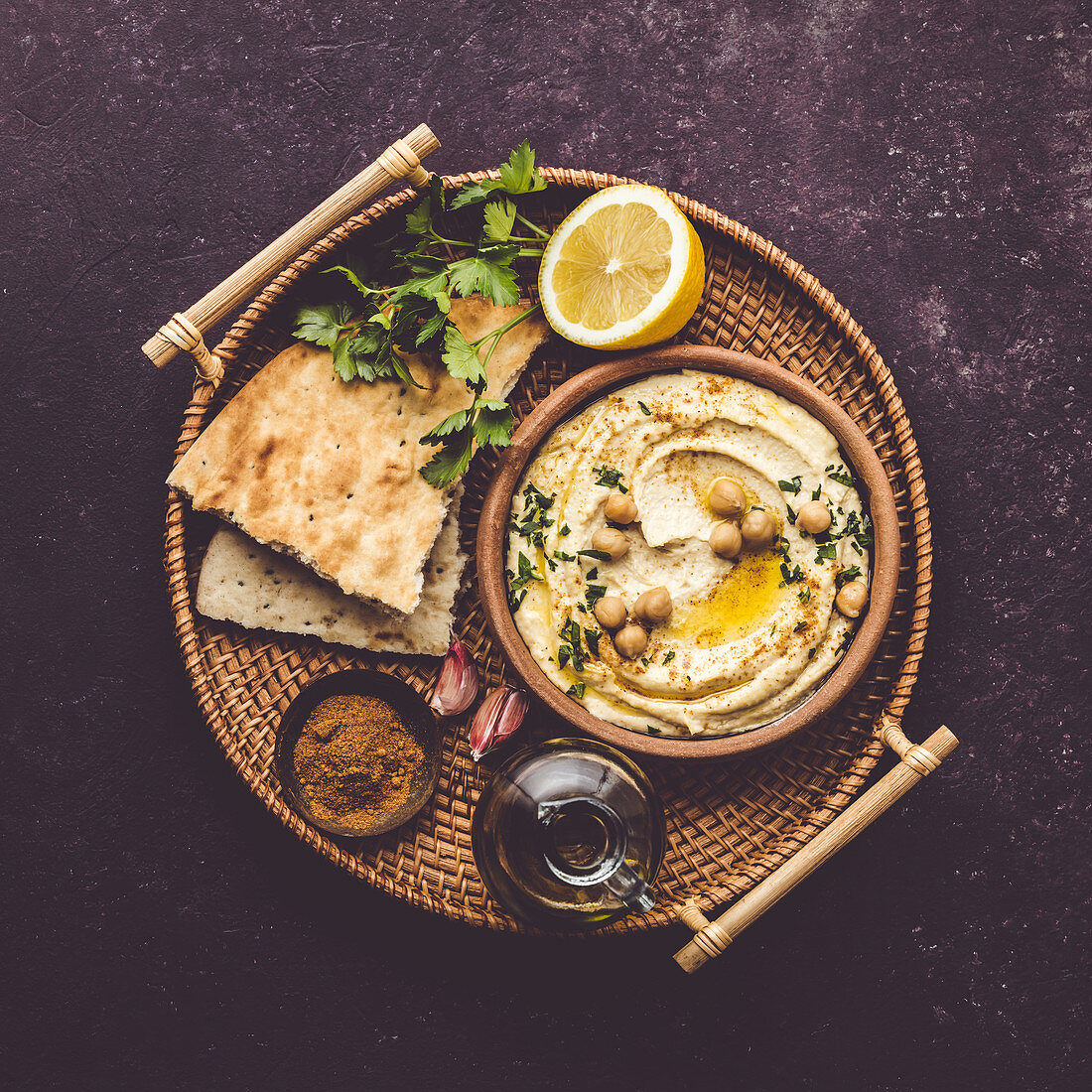 Homemade hummus with flatbread on tray