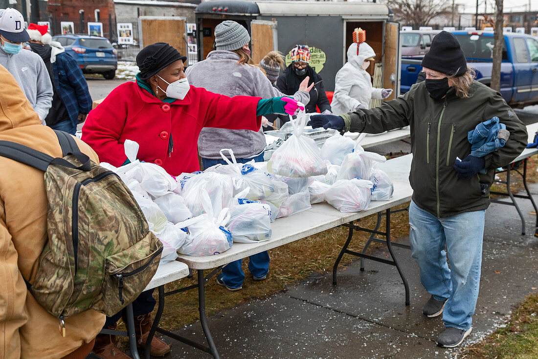 Volunteers distributing food to the homeless