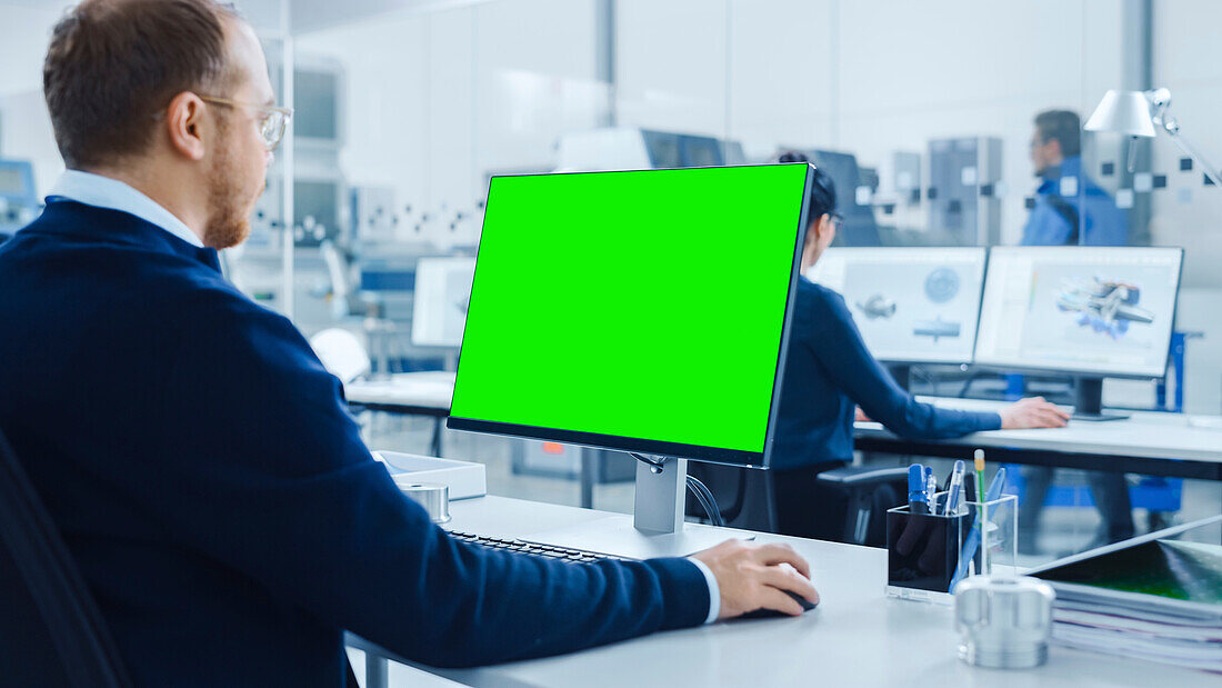 Engineer using a green screen