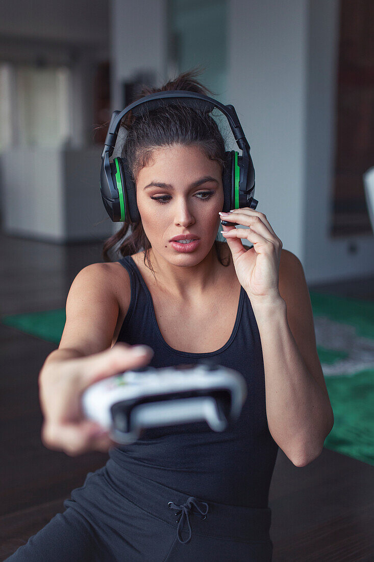 Woman playing on game console