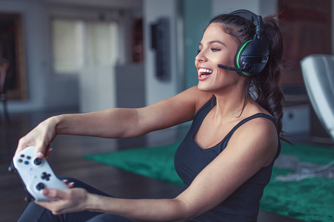 Woman playing on game console