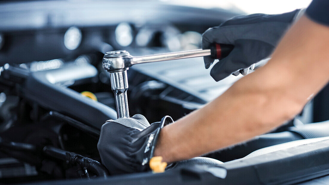 Mechanic working on car