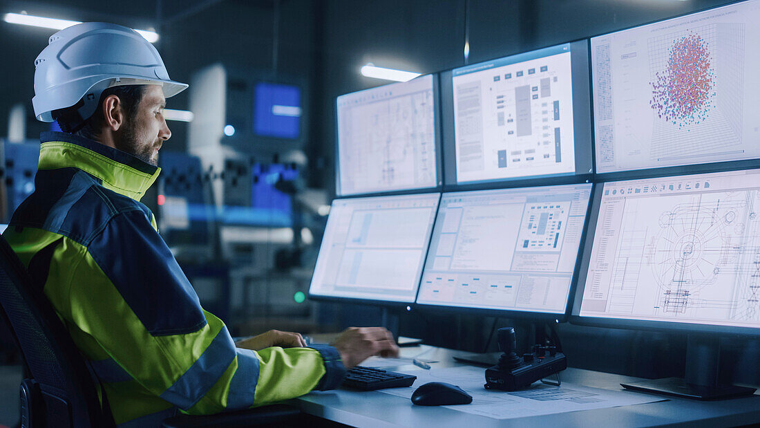 Engineer in factory control room