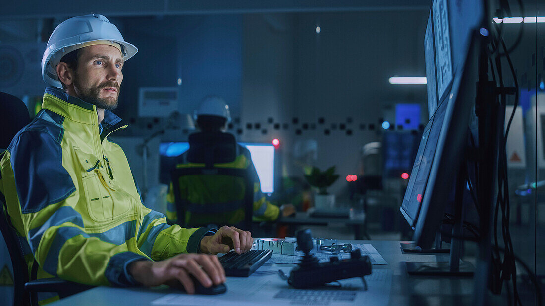 Engineer in factory control room