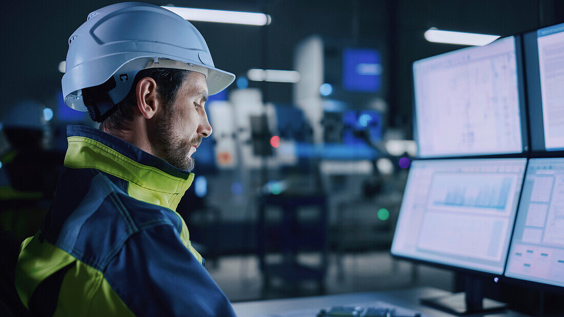 Engineer in factory control room